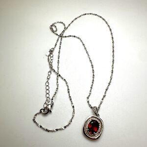 1.3ct Mozambique Garnet with halo of cz diamonds, pendant on a 18" 925 chain!